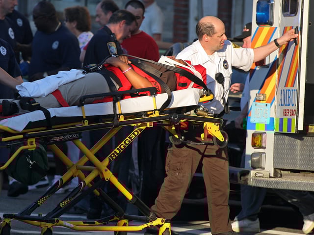 One of two pedestrians, including a child, that was struck by a car, is wheeled into a waiting ambulance today, August 17, 2011, in South Boston at the corner of Dorchester and East 7th streets. Staff Photo by Mark Garfinkel (Photo by Mark Garfinkel/MediaNews Group/Boston Herald via Getty Images)