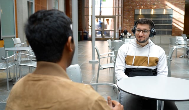 A University of Washington team has developed an artificial intelligence system that lets a user wearing headphones look at a person speaking for three to five seconds and then hear just the enrolled speaker’s voice in real time even as the listener moves around in noisy places and no longer faces the speaker. (University of Washington Photo / Kiyomi Taguchi)