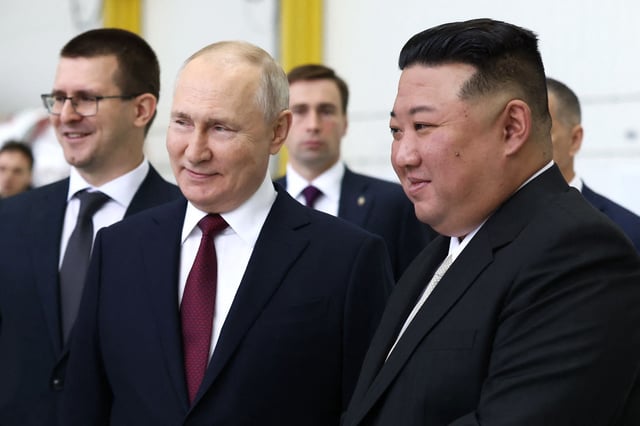 Russia's President Vladimir Putin, from center, and North Korea's leader Kim Jong Un, from right, visit the Vostochny Cosmodrome in Amur region on Sept. 13, 2023.