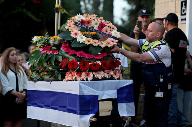 Relatives lay wreaths on the coffin during the funeral of Israeli hostage Chanan Yablonka, at Kiryat Shaul Cemetery in Tel Aviv, Israel on Sunday. Photo: EPA-EFE