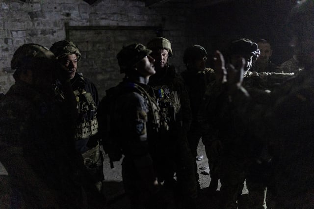 Ukrainian soldiers in Marinka close to the frontline in Donetsk Oblast on May 9, 2024. 