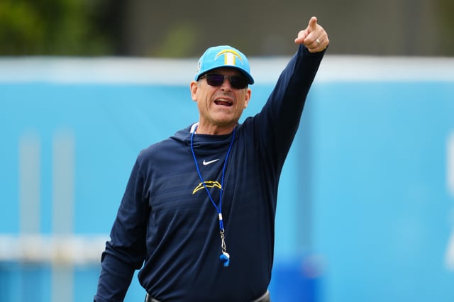 Chargers coach Jim Harbaugh reacts during organized team activities at the Hoag Performance Center in Costa Mesa, California.