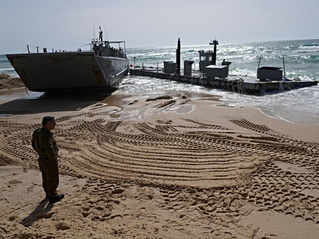 A U.S. Army landing craft is seen beached in Ashdod on Sunday, May 26, 2024, after being swept by wind and current from the temporary humanitarian pier in the Gaza Strip. (AP Photo/Tsafrir Abayov)