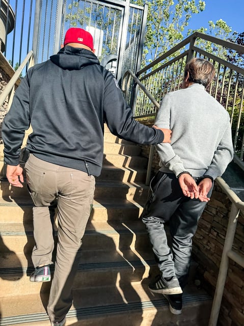 Tuen Kit Lee is led away in handcuffs in Danville, Calif., on Tuesday.