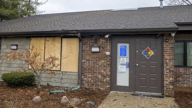 FILE- A front window is boarded up at the Planned Parenthood Health Center at 2709 Knoxville Avenue in Peoria, Ill., on Monday, Jan. 16, 2023. Tyler W. Massengill of Chillicothe, Ill. pleaded guilty Thursday, Feb 16, 2023, to “malicious use of fire” to damage the Planned Parenthood clinic last month, federal law enforcement said. (Matt Dayhoff/Journal Star via AP)