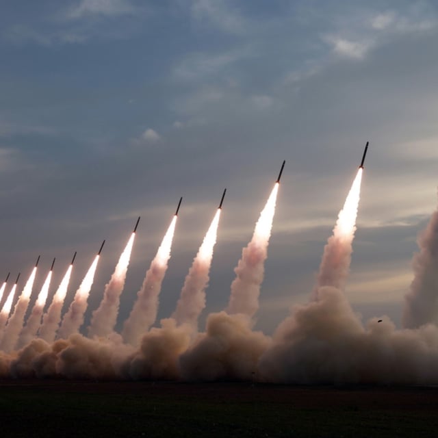 This photograph released on May 31 by North Korea's official Rodong Sinmun newspaper shows a salvo of 18 ballistic missiles fired from Pyongyang the previous day.