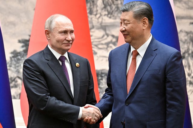 Russian President Vladimir Putin (left) and Chinese President Xi Jinping meet in Beijing on May 16. Photo: Reuters