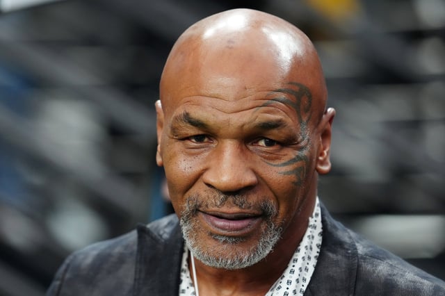 Mike Tyson, shown at an NFL game in 2023, had an ulcer flare-up during a recent flight.