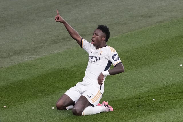 Real Madrid's Vinicius Junior celebrates after scoring his side's second goal during the Champions League final soccer match between Borussia Dortmund and Real Madrid at Wembley stadium in London, Saturday, June 1, 2024. (AP Photo/Alastair Grant)