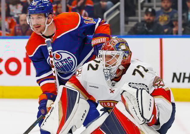 Edmonton Oilers forward Zach Hyman (18) looks for a pass beside Florida Panthers goaltender Sergei Bobrovsky (72) during a December game.