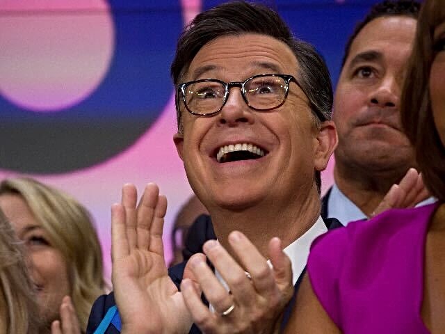 TV personality Stephen Colbert applauds during the opening bell in celebration of the ViacomCBS Inc. merger at the Nasdaq MarketSite in New York, U.S., on Thursday, December 5, 2019. Viacom Inc. and CBS Corp. completed their merger on Wednesday, ending three years of on-and-off talks and creating what they boast is an entertainment colossus without peer. Photographer: Michael Nagle/Bloomberg via Getty Images