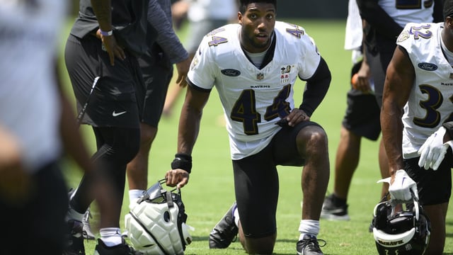FILE - Baltimore Ravens cornerback Marlon Humphrey (44) works out during the team's NFL football training camp, Saturday, July 29, 2023, in Baltimore. Humphrey was set to have foot surgery Wednesday, Aug. 16, a potentially significant blow to the team's defensive backfield. Coach John Harbaugh said it wouldn't be a long-term injury, but he didn't give a more specific timeline and the start of the regular season is less than four weeks away. (AP Photo/Nick Wass, File)