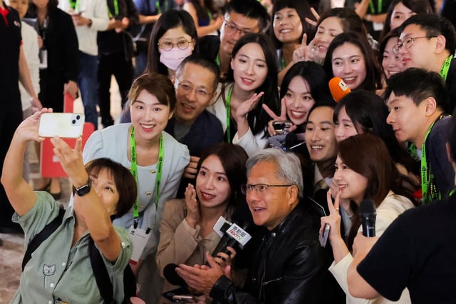 Nvidia CEO Jensen Huang poses for a selfie at Computex. Photo: Reuters