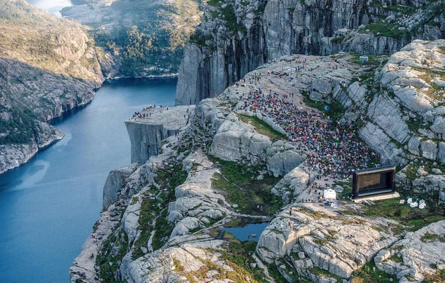 People gather in the mountains near Preikestolen to see the movie "Mission: Impossible Fallout."