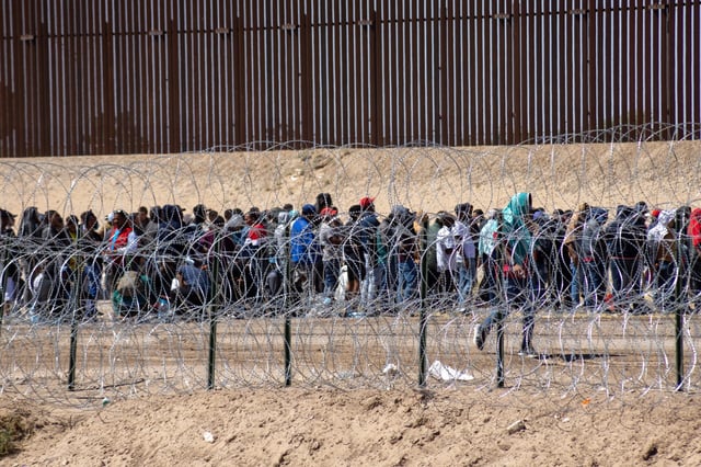 Asylum-seekers waiting at the border at the Texas-Mexico border in 2023.