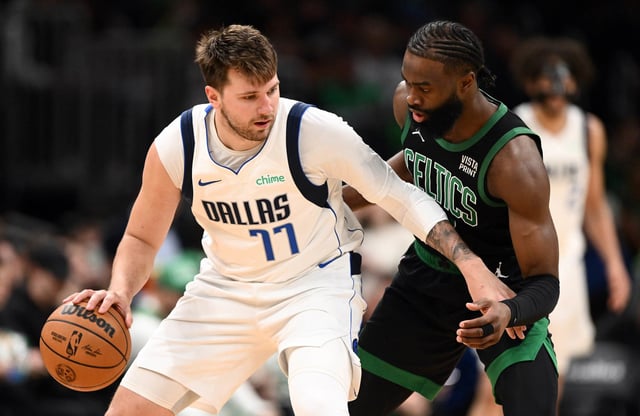 Jaylen Brown #7 of the Boston Celtics defends Luka Doncic #77 of the Dallas Mavericks during the third quarter at the TD Garden on March 01, 2024 in Boston, Massachusetts. 