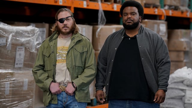 KILLING IT -- "Timber" Episode 208 -- Pictured: (l-r) Scott MacArthur as Brock, Craig Robinson as Craig -- (Photo by: Tyler Golden/PEACOCK)