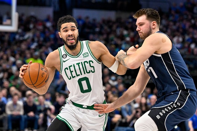 Celtics forward Jayson Tatum drives against Mavericks guard Luka Doncic during a game at the American Airlines Center in Dallas on Jan. 5, 2023.