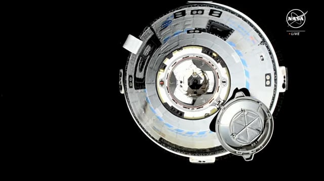 A view from the International Space Station shows the approach of Boeing's Starliner capsule. (NASA via YouTube)