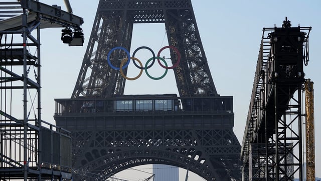 The Olympic rings are seen on the Eiffel Tower Friday, June 7, 2024 in Paris. The Paris Olympics organizers mounted the rings on the Eiffel Tower on Friday as the French capital marks 50 days until the start of the Summer Games. The 95-foot-long and 43-foot-high structure of five rings, made entirely of recycled French steel, will be displayed on the south side of the 135-year-old historic landmark in central Paris, overlooking the Seine River. (AP Photo/Michel Euler)