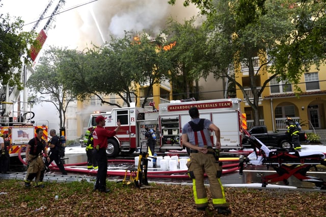 City of Miami Fire Rescue firefighters work at the scene of a fire at the Temple Court apartments Monday, June 10, 2024, in Miami. (AP Photo/Lynne Sladky)
