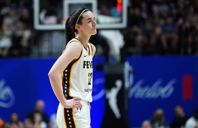 Indiana Fever guard Caitlin Clark (22) reacts after her third foul against the Connecticut Sun in the second quarter, Monday night at Mohegan Sun Arena.