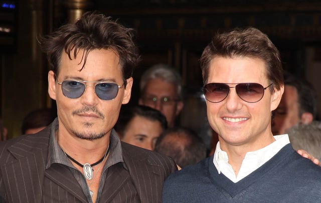 Johnny Depp and Tom Cruise on June 24, 2013 in Hollywood, California. CREDIT: Getty/Photo by Michael Tran/FilmMagic
