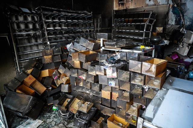 Debris and reptile cages are seen following a fire, in which exotic animals, reptiles, and pets perished at Chatuchak Weekend Market in Bangkok, Thailand, June 11, 2024. REUTERS/Athit Perawongmetha
