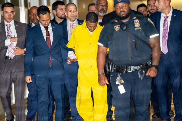 Felix Herrera-Garcia, in yellow, in Court in the Bronx, New York, on Oct. 5, 2023. 