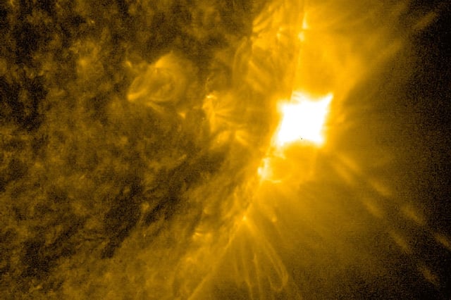 NASA’s Solar Dynamics Observatory captured this image of a solar flare – seen as the bright flash on the Sun’s right edge – on June 10. The image shows a subset of extreme ultraviolet light that highlights the extremely hot material in flares and which is colorized in gold. Credit: NASA/SDO