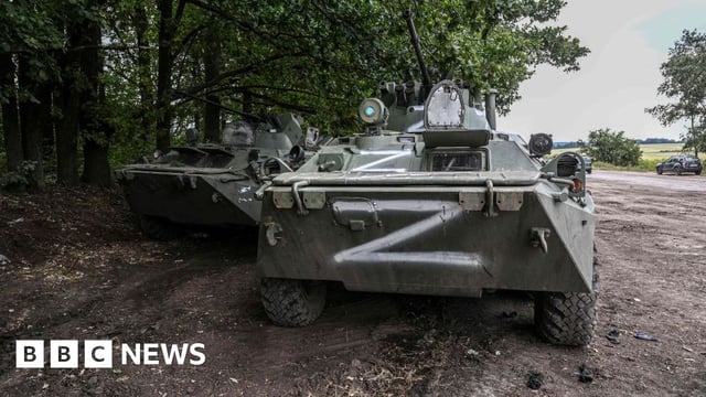 This photograph taken on September 10, 2022 shows Russian military vehicles in Balakliya, Kharkiv region