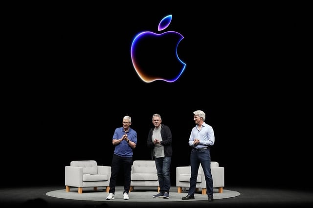 Apple CEO Tim Cook, left, speaks as he is joined by Craig Federighi, right, senior vice president of software engineering, and John Giannandrea, senior vice president of machine learning and AI strategy, during an Apple event in Cupertino, Califorinia, on June 10, 2024. 