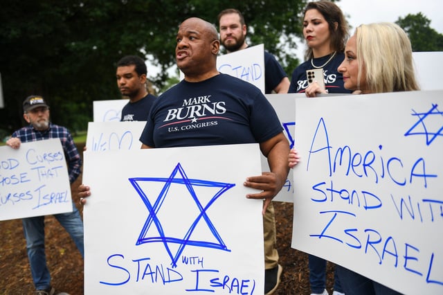 Pastor Mark Burns, a Donald Trump endorsed congressional candidate for South Carolina District 3, which includes Clemson, speaks to the media during the Pro-palestine protest outside of Sikes Hall at Clemson University on Saturday, May 4, 2024.