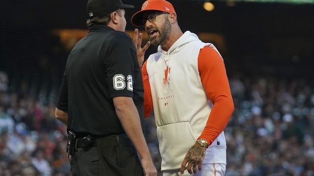San Francisco Giants manager Gabe Kapler, right, gestures toward home plate umpire Chad Whitson after being ejected by Whitson during the fourth inning of a baseball game between the Giants and the Tampa Bay Rays in San Francisco, Tuesday, Aug. 15, 2023. (AP Photo/Jeff Chiu)