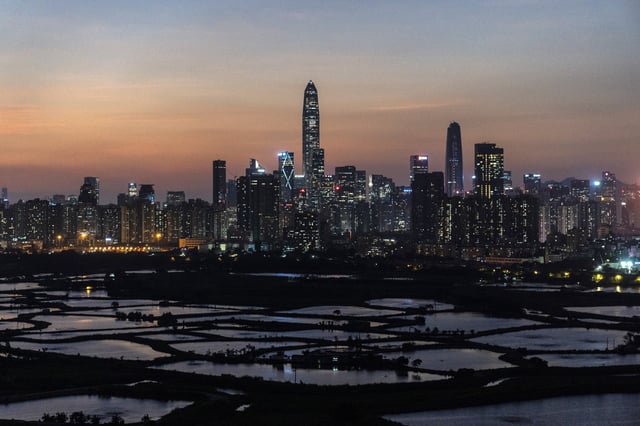 Buildings in Shenzhen loom beyond farmland in the Lok Ma Chau area of Hong Kong, site of the future Northern Metropolis project, on October 11, 2021. Photo: Bloomberg