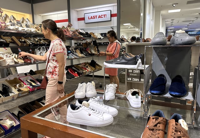 People shop for shoes in a store at The Village at Corte Madera on May 30, 2024, in Corte Madera, California.