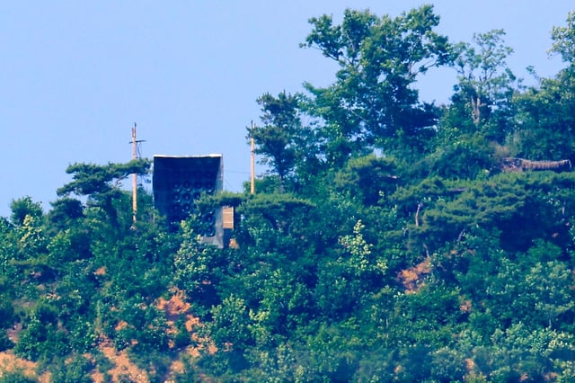 What appear to be North Korean loudspeakers are pictured from across the border in South Korea on June 11. The North’s broadcasts are mostly aimed at “suppressing” those coming from the South, defectors say. Photo: Yonhap via AP