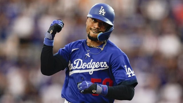Los Angeles Dodgers' Mookie Betts runs the bases after hitting a home run against the Miami Marlins.