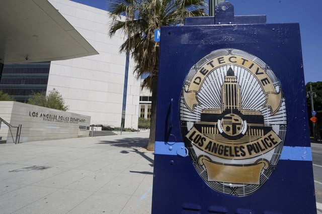 The Los Angeles Police Department headquarters building is seen downtown Los Angeles, July 8, 2022. The city of Los Angeles has agreed to pay $300,000 to cover the lawyer fees of a local journalist and activist group it sued last year for publishing photos of names and photographs of undercover officers obtained through a public records request, the journalist's attorney said Monday, June 17, 2024. (AP Photo/Damian Dovarganes, File)
