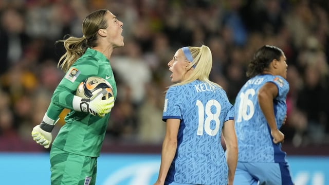 England's goalkeeper Mary Earps, left, reacts after saving a penalty shot by Spain's Jennifer Hermoso during the final of Women's World Cup soccer between Spain and England at Stadium Australia in Sydney, Australia, Sunday, Aug. 20, 2023. (AP Photo/Rick Rycroft)