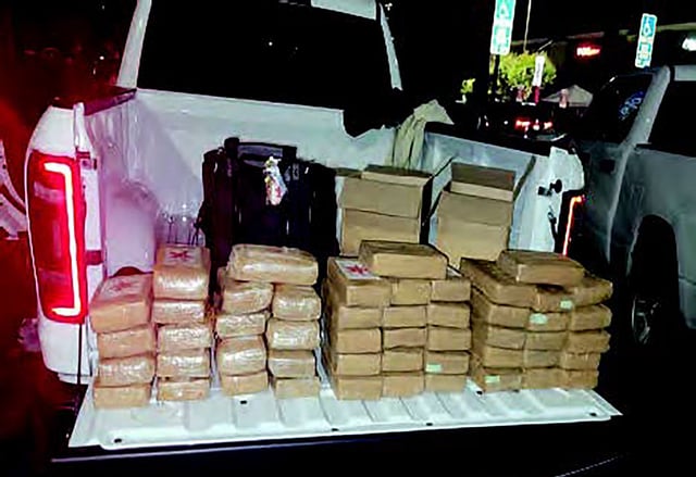An undated image provided by US authorities shows confiscated drugs piled up in a truck bed. Photo: US District Attorney via AP