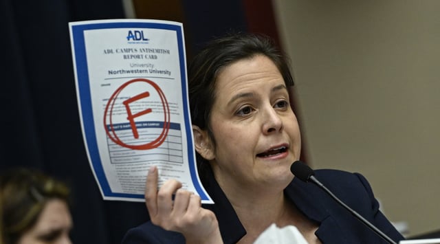 New York Republican U.S. Rep. Elise Stefanik displays the Anti-Defamation League's "F" campus report card grade for Northwestern as the presidents of that school, Rutgers, and UCLA testify before the committee in the Rayburn House Office Building on Capitol Hill in Washington DC, United States on May 23, 2024. (Celal Gunes/Anadolu via Getty Images)