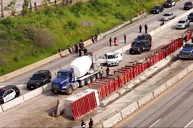 Police investigate a chase along I-43, in Milwaukee on Thursday.