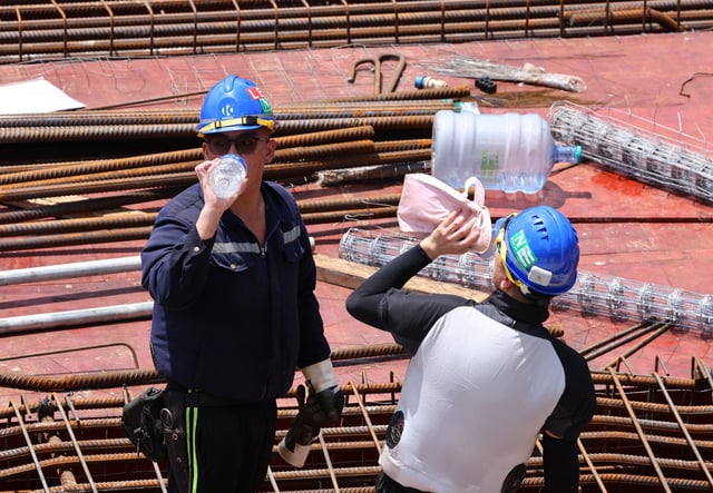 Employees working in jobs that require physical exertion and being out in the open should take a short rest every hour, family doctor Edmund Lam has said. Photo: Dickson Lee