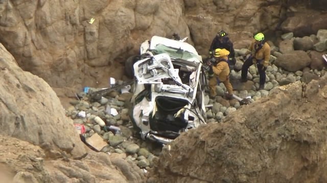 This image from the San Mateo County Sheriff's Office shows the Tesla on a rocky beach below the cliffs, in an area called Devil's Slide.