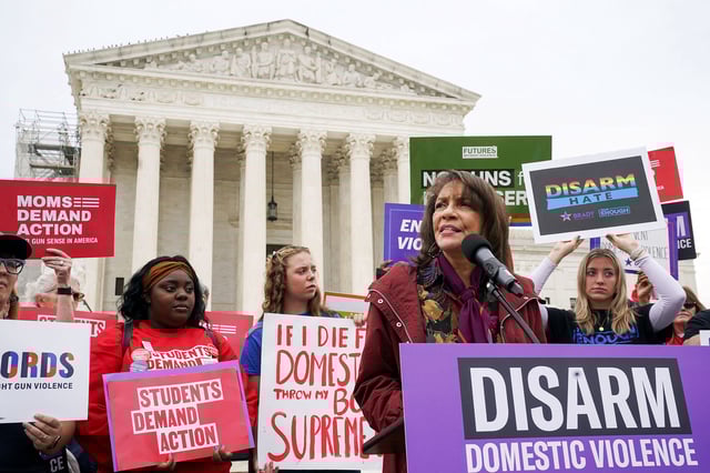 Ruth Glenn, President of Survivor Justice Action, addresses the crowd as as oral arguments are heard in the case of United States v. Rahimi in November 2023, in Washington, D.C.