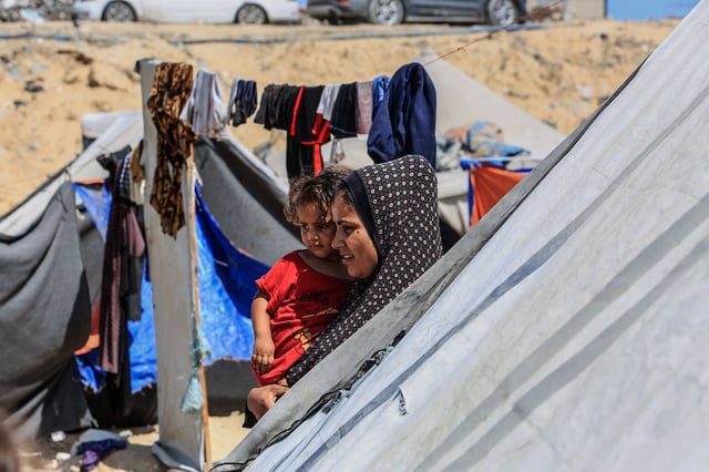 Palestinians, who fled their homes due to the Israeli attacks on Gaza, try to go on their daily lives under hard conditions in Deir Al Balah, Gaza, on June 19, 2024.