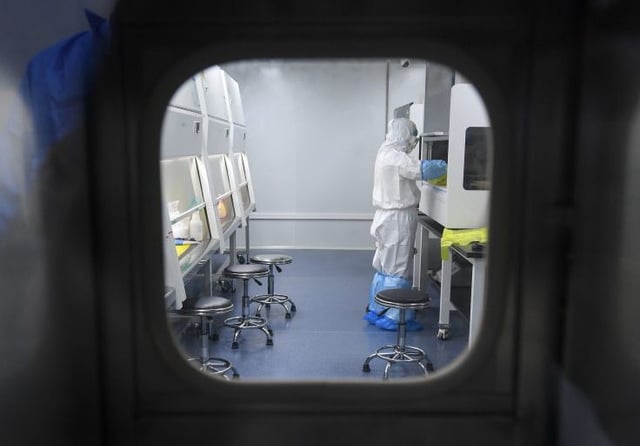 A Wuhan, China, lab technician in Feb. 2020 ( Getty Images)