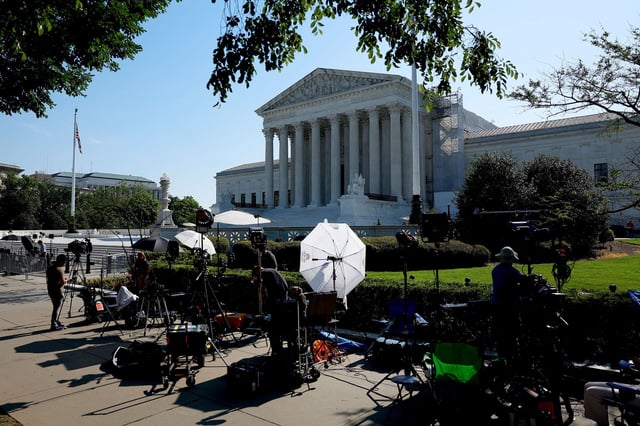 TV journalists work outside of the US Supreme Court Building on June 14 in Washington, DC.