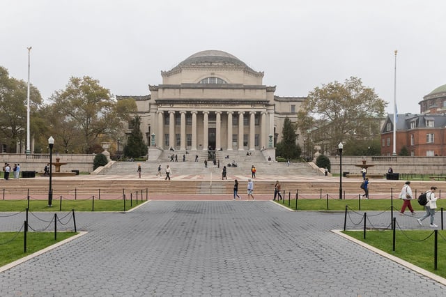 People walk past Columbia University in New York on October 30, 2023.